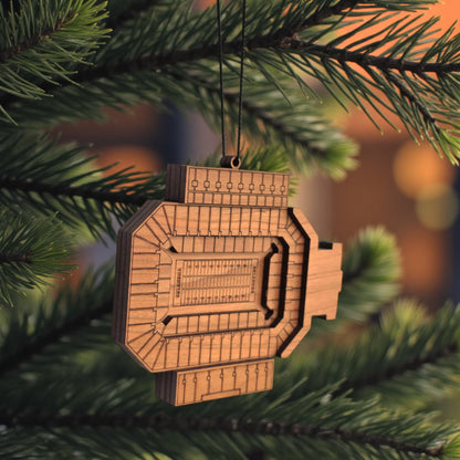 Angled view of Gaylord Family Memorial Stadium wooden ornament hanging from black cord, layered wood OU football stadium ornament for sports fan gift