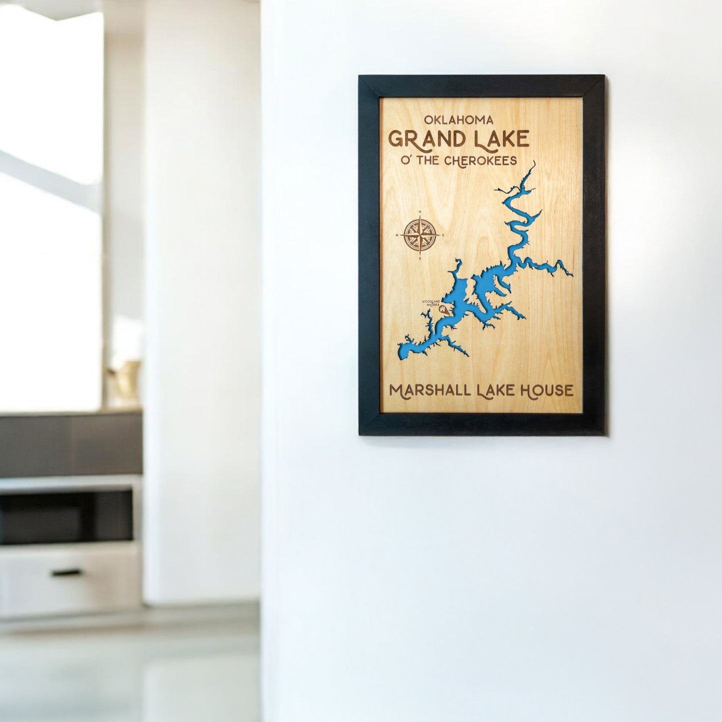 Grand Lake O’ the Cherokees framed wooden map displayed on a wall in a modern home interior