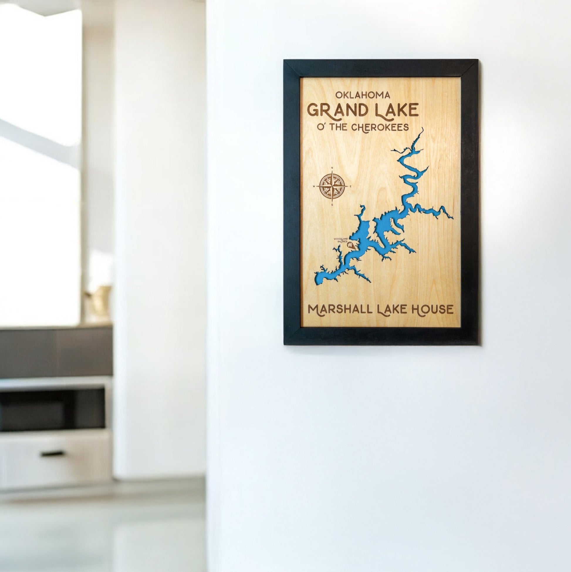 Grand Lake O’ the Cherokees framed wooden map displayed on a wall in a modern home interior