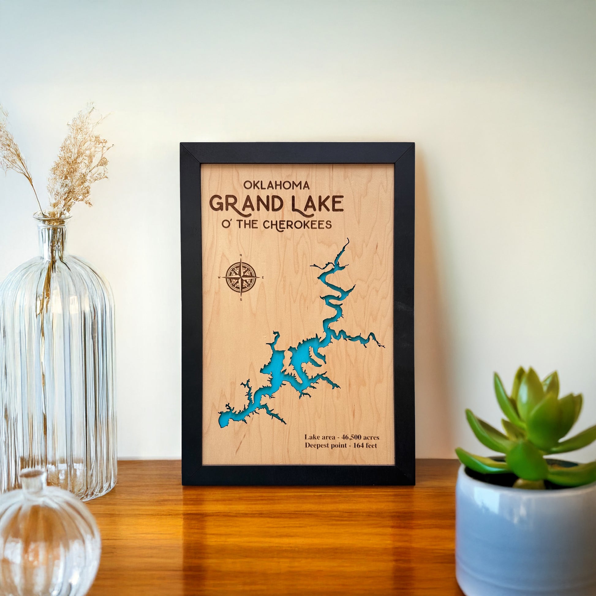 Grand Lake O’ the Cherokees wooden map wall art displayed on a shelf with home decor