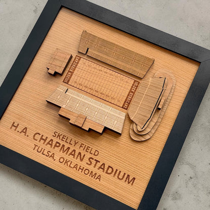 Angled view of layered wood H.A. Chapman Stadium wall art showing engraved seating sections and football field details inside black display frame inspired by Tulsa Golden Hurricane football