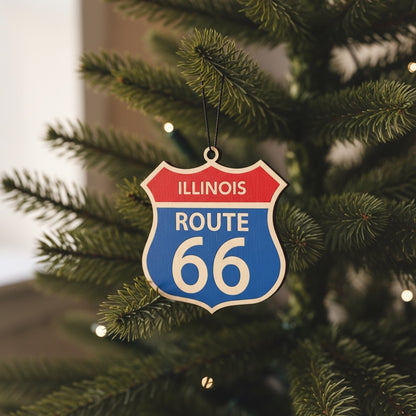 Illinois Route 66 wooden ornament hanging on a Christmas tree with warm lights, vintage highway sign holiday ornament for Route 66 travelers and souvenir collectors