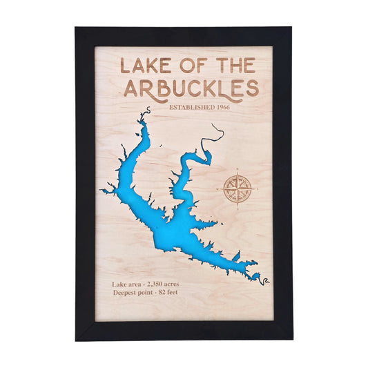 Lake of the Arbuckles wooden map wall art in black frame showing lake outline cut into natural wood with blue water layer, Oklahoma lake decor ready to hang