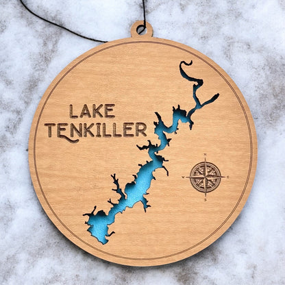 Close up of Lake Tenkiller wooden map ornament showing laser cut shoreline detail, engraved compass, and painted blue water layer