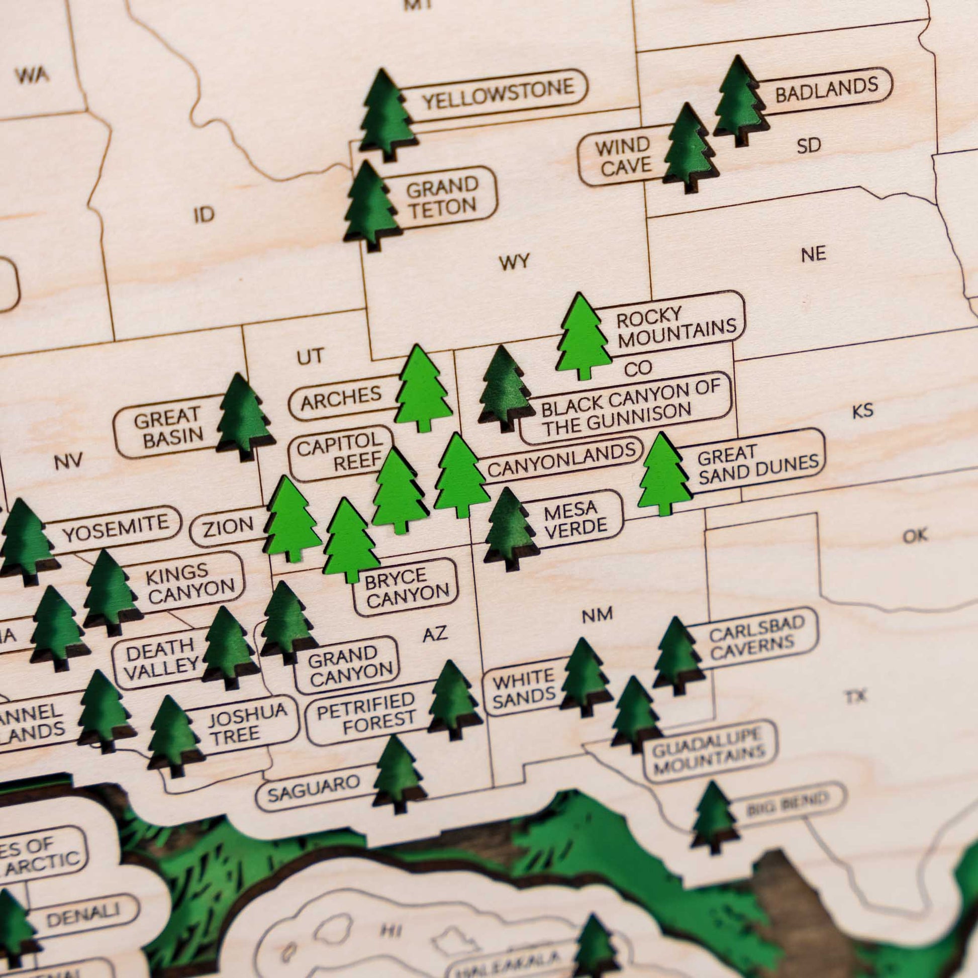 Wooden travel map of USA National Parks featuring detailed laser-cut design and green tree markers