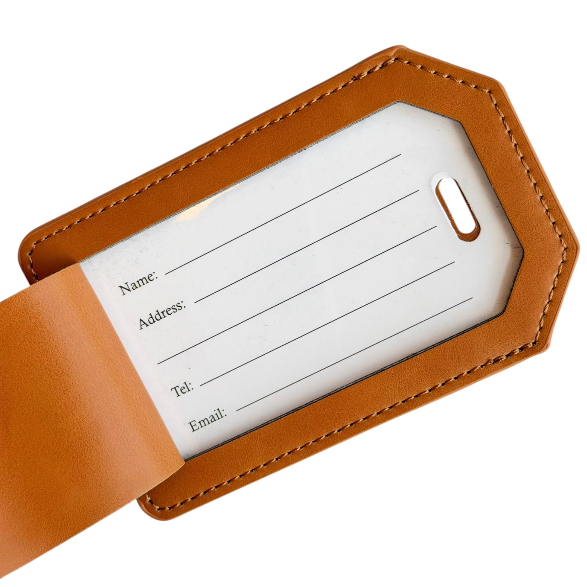 Close-up of tan leatherette luggage tag with covered traveler information card showing spaces for name, address, telephone number, and email for identifying luggage during travel