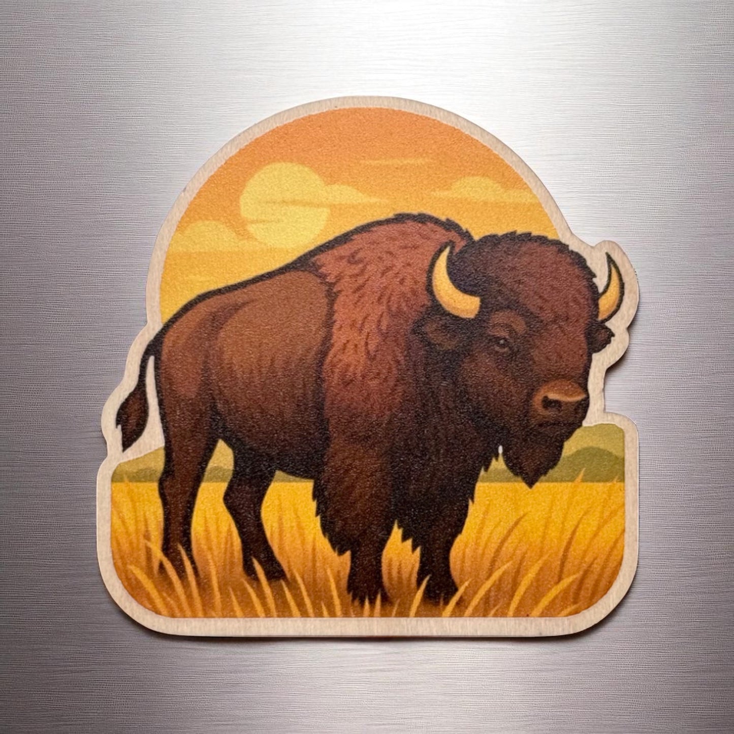 Oklahoma bison wooden magnet displayed on a metal surface, prairie scene bison magnet with warm sunset colors and natural wood edge