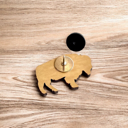Back of Oklahoma American bison wooden pin showing metal post and black rubber pin back, lightweight wooden lapel pin for hats and jackets