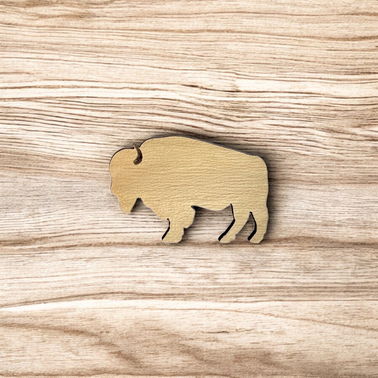Oklahoma American bison wooden pin displayed on wood surface, clean bison silhouette lapel pin for state pride and travel gifts