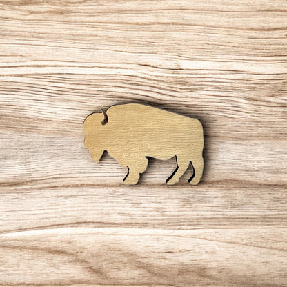 Oklahoma American bison wooden pin displayed on wood surface, clean bison silhouette lapel pin for state pride and travel gifts