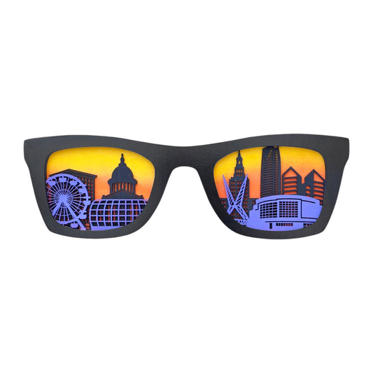 Black Oklahoma City skyline glasses wall art featuring 3D city silhouette and orange sunset tones, Oklahoma home décor piece.