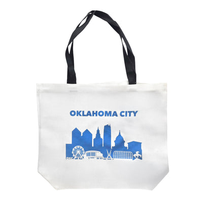 Oklahoma City skyline tote bag with blue city silhouette printed on white canvas, Oklahoma City souvenir tote bag with black handles