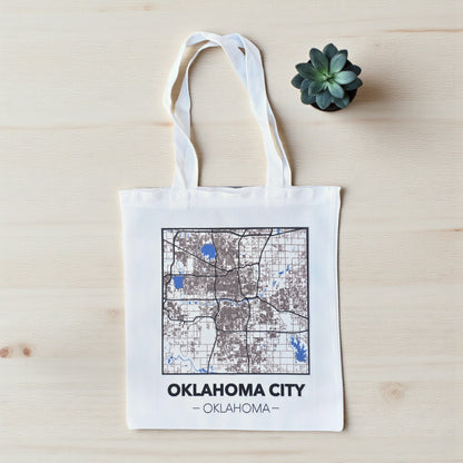 Small Oklahoma City map tote bag flat lay on wood surface, compact city map tote with white handles for errands or souvenirs