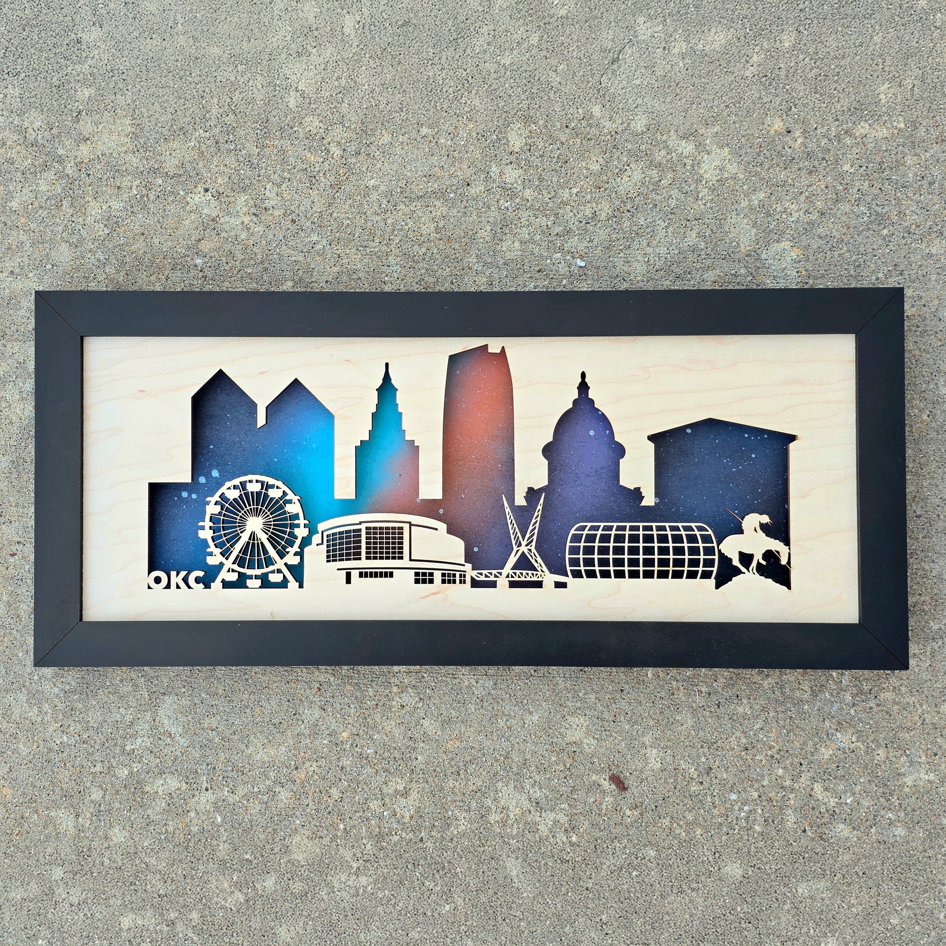 Oklahoma City Night Skyline layered wood wall art with laser-cut buildings, Ferris Wheel, and Skydance Bridge, handmade Oklahoma decor.