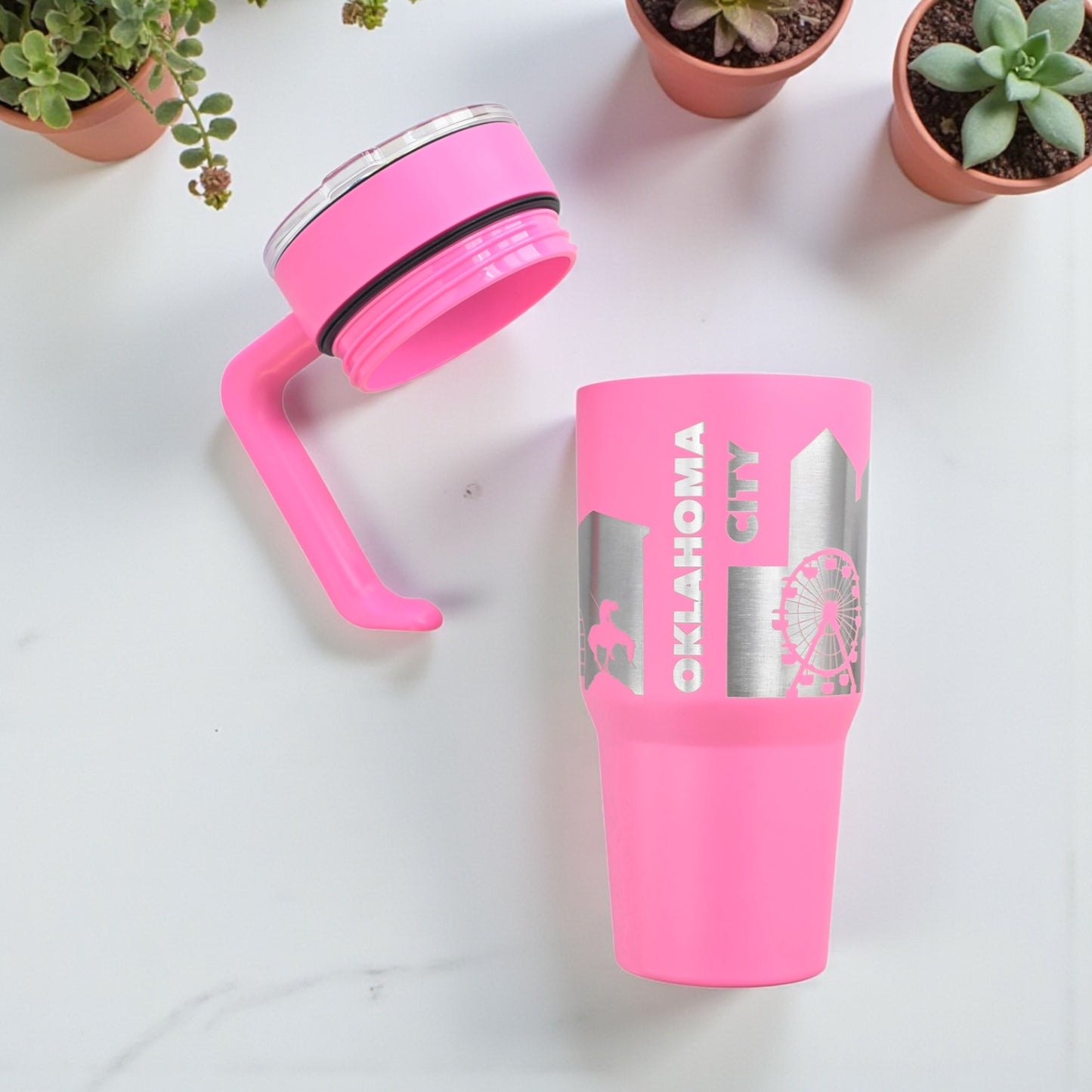 Pink Oklahoma City skyline 30oz tumbler shown with detachable handle and lid separated, engraved stainless steel travel mug components