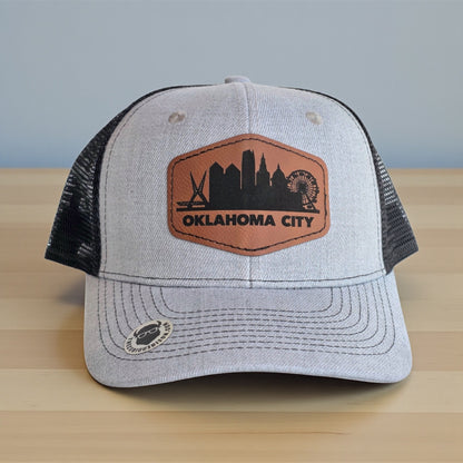 Front view of Oklahoma City Skyline Hat featuring engraved leatherette patch, Oklahoma souvenir cap made by The Curious Bison.