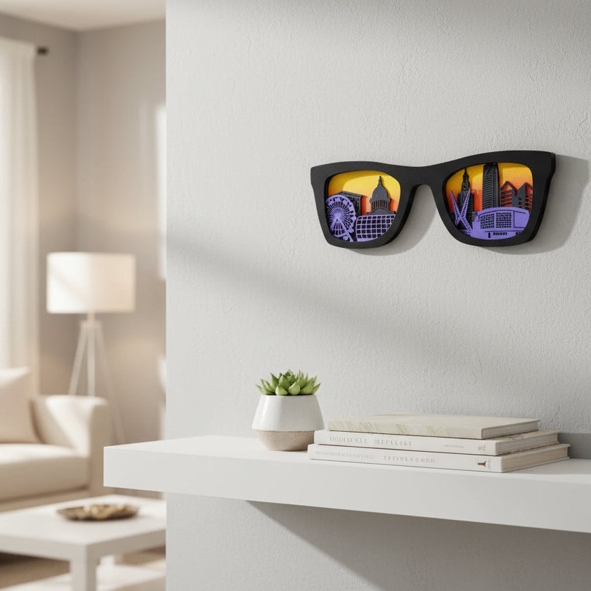 Black sunglasses shaped layered wood wall art featuring Oklahoma City skyline with Ferris wheel, capitol dome, skyscrapers, and arena against sunset sky background, modern OKC home decor gift and Oklahoma travel souvenir
