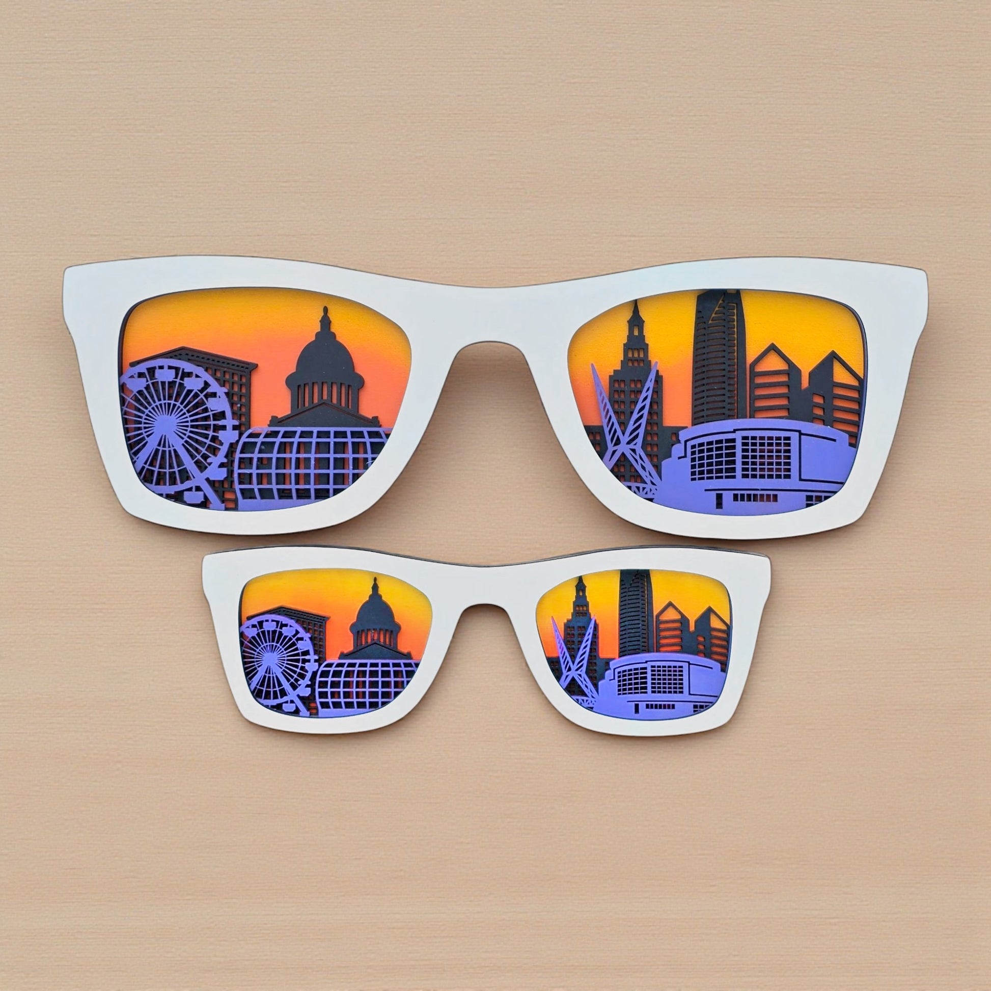 White Oklahoma City skyline glasses wall décor with layered wood design and vivid sunset colors, handmade OKC city art by The Curious Bison.