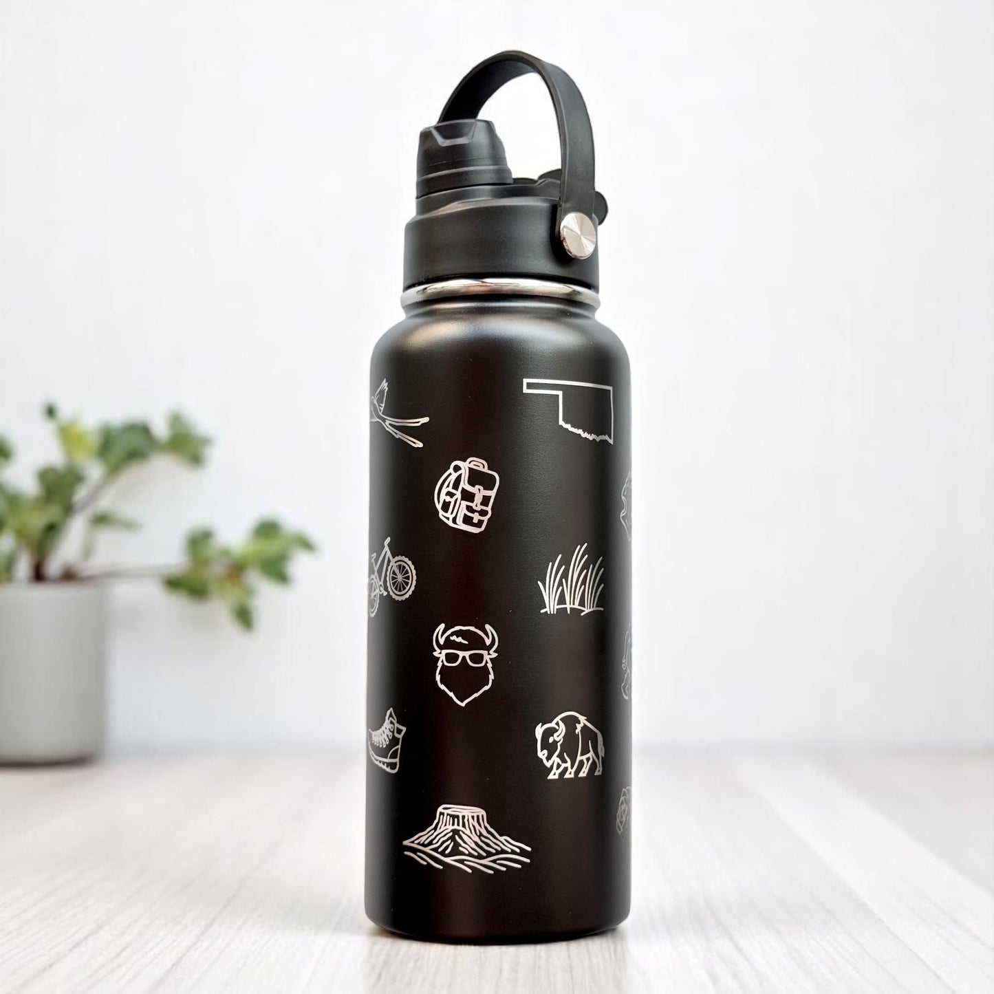 Black Oklahoma icons 32oz insulated water bottle with laser engraved state symbols and powder coated finish