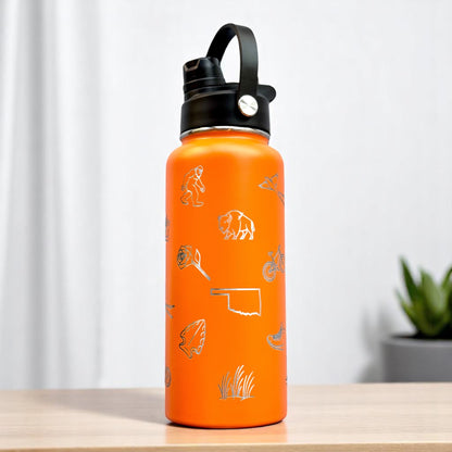 Angled view of orange Oklahoma symbols water bottle with laser engraved icons and flip top carry lid