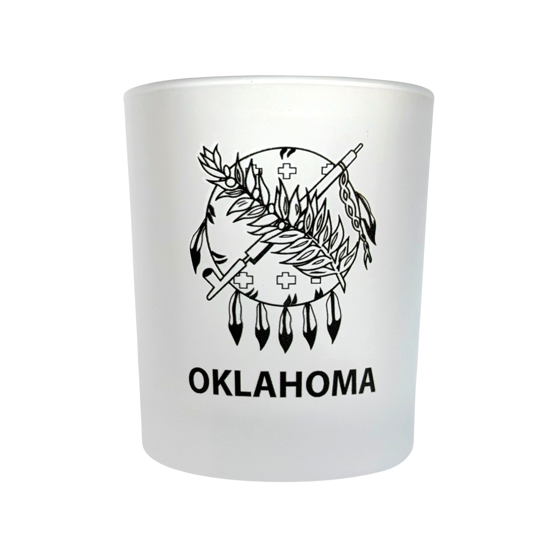 Angled view of an 8 oz frosted Oklahoma lowball whiskey glass with Oklahoma state flag inspired artwork, perfect for bourbon, scotch, cocktails, and Oklahoma gift giving.