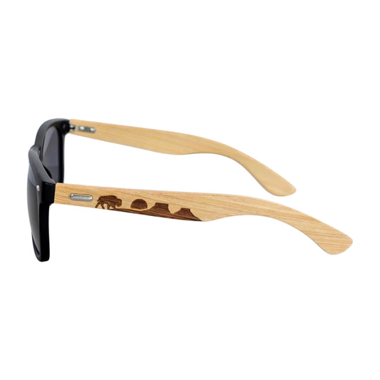 Oklahoma bamboo sunglasses with engraved nature and animal design on bamboo arms, black frame sunglasses shown from side angle as Oklahoma gift or souvenir
