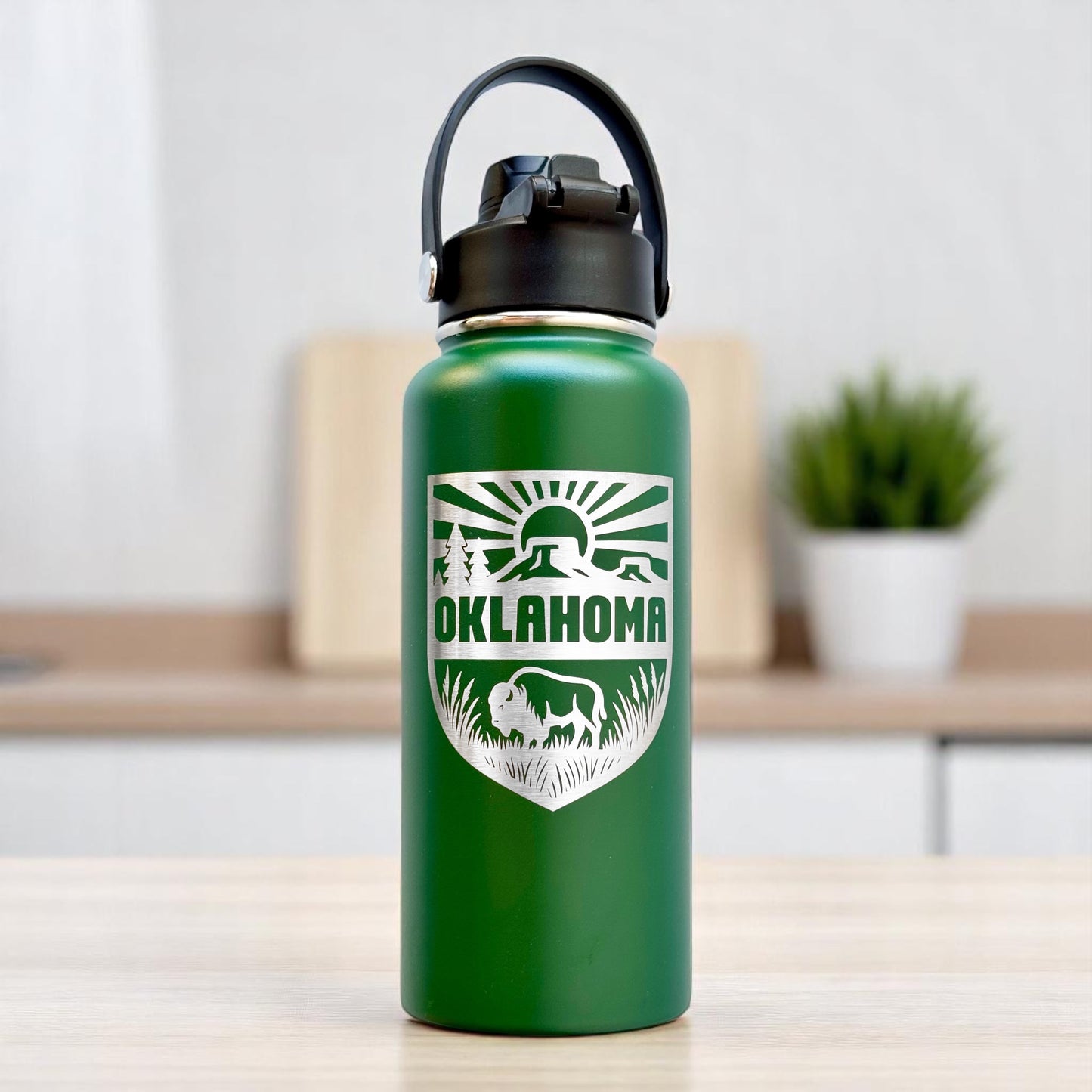 Green Oklahoma outdoor adventure 32oz insulated water bottle with engraved bison prairie and sun design