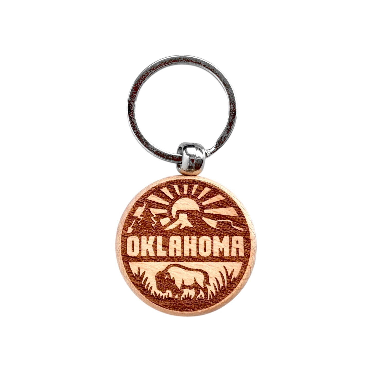 Round Oklahoma outdoor adventure wooden keychain with laser engraved bison, sun rays, mountains, and Oklahoma text, lightweight wood keychain with metal ring for Oklahoma souvenir or Route 66 travel gift made in the USA