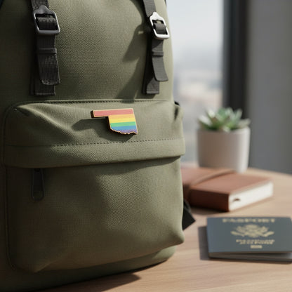 Oklahoma rainbow wooden lapel pin attached to backpack, Pride souvenir pin for travel bags, jackets, and Oklahoma gift shoppers