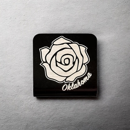 Square aluminum hat clip with Oklahoma rose design displayed against a neutral background showing engraved line detail