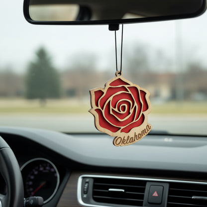 Layered wooden Oklahoma rose car ornament hanging from rearview mirror, red rose design with engraved Oklahoma script, laser cut wood auto accessory gift for Oklahoma locals, flower lovers, and Route 66 souvenir collectors