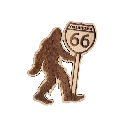 Oklahoma Route 66 Bigfoot wooden magnet showing Sasquatch silhouette holding an Oklahoma 66 highway shield, laser cut layered wood magnet for Oklahoma souvenir or Route 66 gift