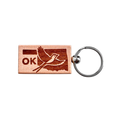Rectangular Oklahoma scissor-tailed flycatcher wooden keychain with laser engraved Oklahoma state outline, flying bird design, and OK text, lightweight wood keychain with metal ring for Oklahoma souvenir or state pride gift made in the USA