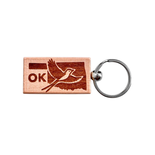 Rectangular Oklahoma scissor-tailed flycatcher wooden keychain with laser engraved Oklahoma state outline, flying bird design, and OK text, lightweight wood keychain with metal ring for Oklahoma souvenir or state pride gift made in the USA
