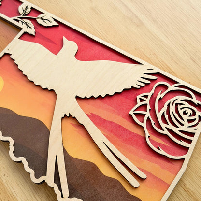 Closeup detail of Oklahoma Scissortail Flycatcher wall art featuring layered wood construction, Oklahoma rose accents, and warm sunset landscape colors inspired by Oklahoma wildlife and prairie scenery