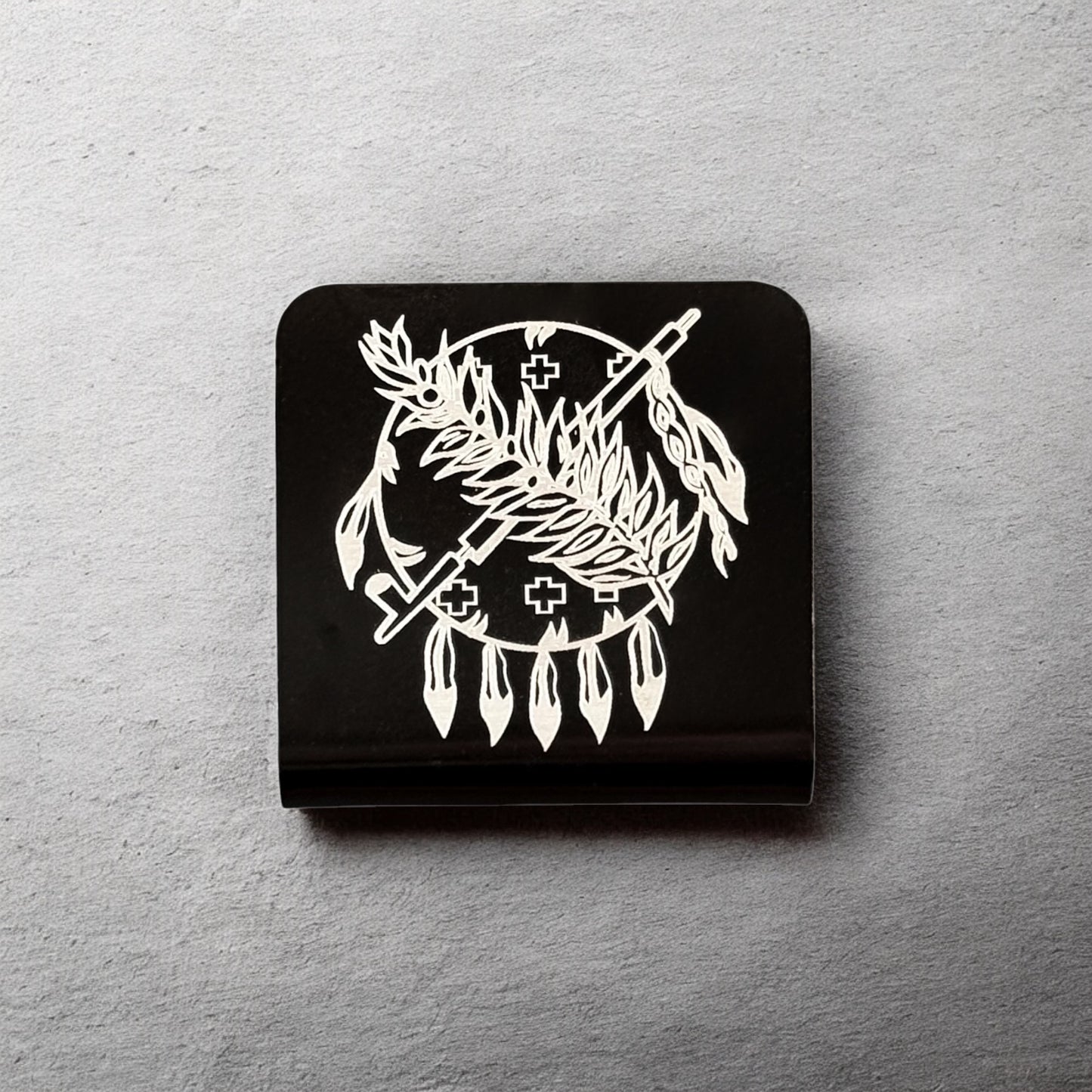 Square aluminum hat clip with Oklahoma symbol design displayed against a neutral background showing engraved line work