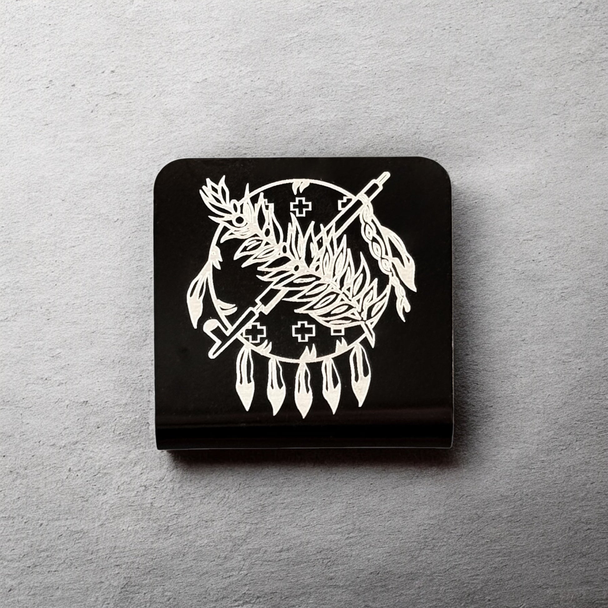 Square aluminum hat clip with Oklahoma symbol design displayed against a neutral background showing engraved line work