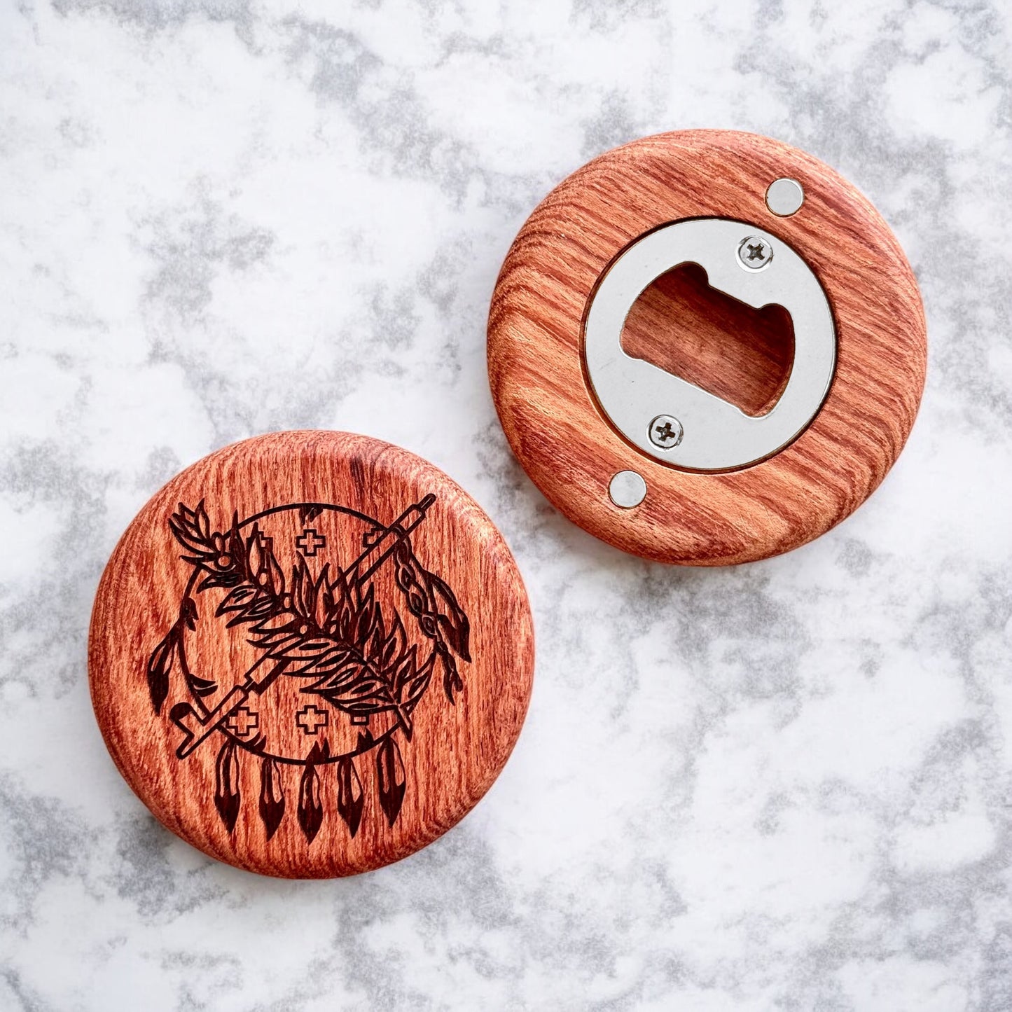 Flatlay image of Oklahoma state symbol bottle opener on cherry wood with magnetic back on a marble background
