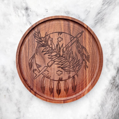Close up of Oklahoma symbol engraving on round walnut catch all tray highlighting wood grain and oiled finish