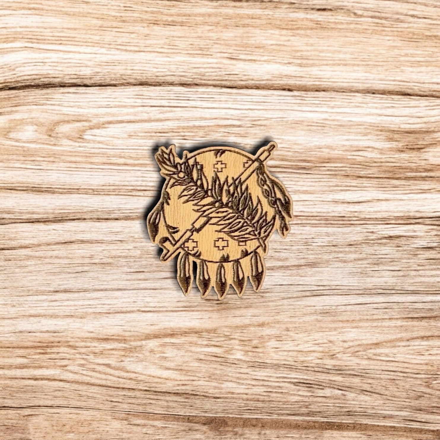 Oklahoma symbol wooden pin displayed on wood surface, engraved heritage inspired design on laser cut wood lapel pin for travel and gift use