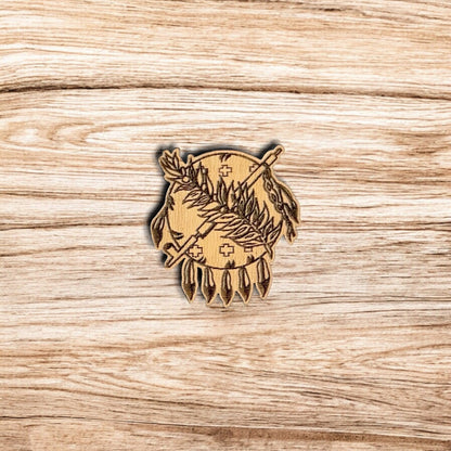 Oklahoma symbol wooden pin displayed on wood surface, engraved heritage inspired design on laser cut wood lapel pin for travel and gift use