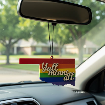 Wooden Oklahoma Yall Means All car ornament hanging from rearview mirror, state silhouette with rainbow pride stripes and layered script lettering, lightweight auto accessory gift supporting inclusion for Oklahoma locals, Route 66 travelers, and USA road trip souvenir collectors