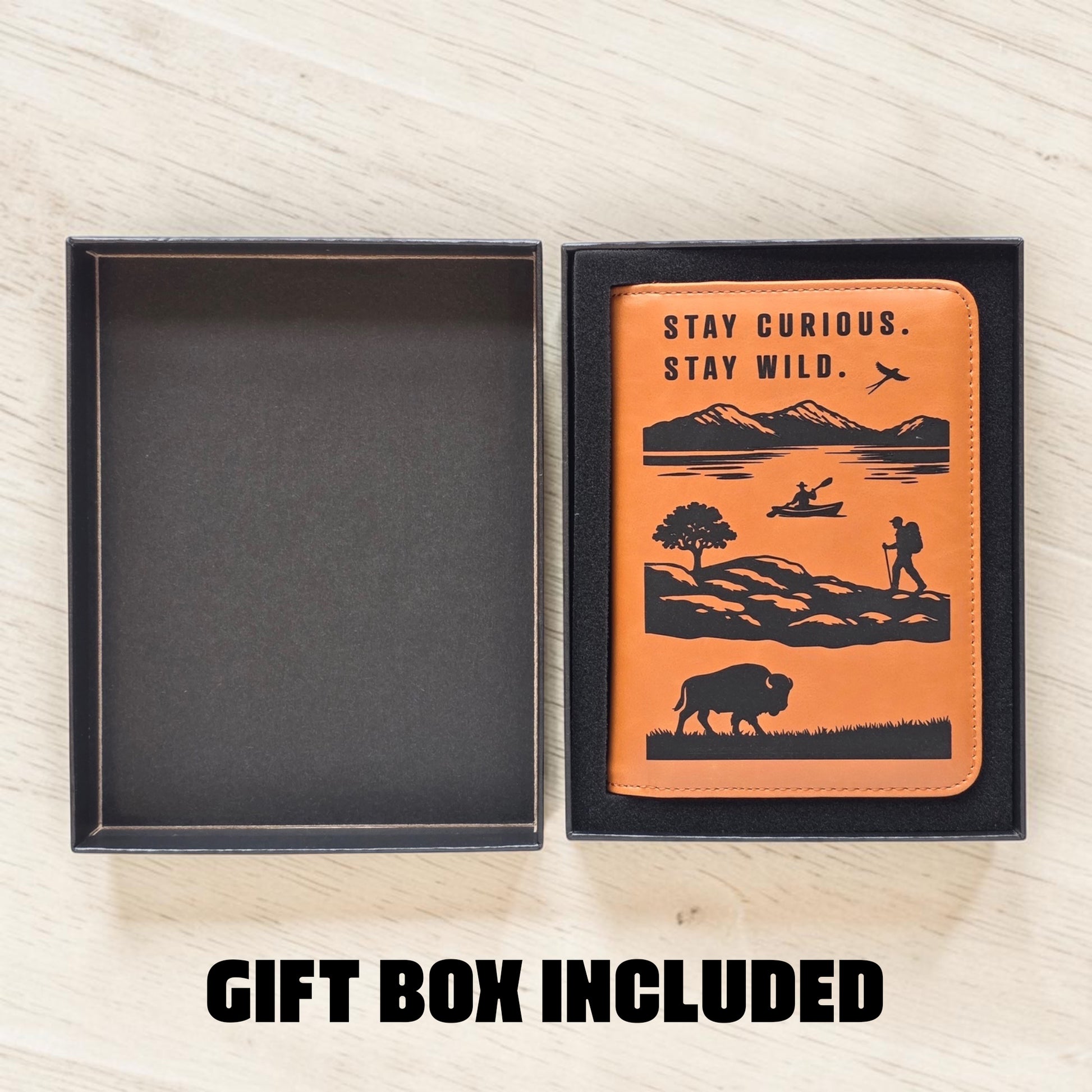 Open gift box beside engraved passport wallet showing presentation packaging, travel themed passport wallet gift for road trip and vacation travelers