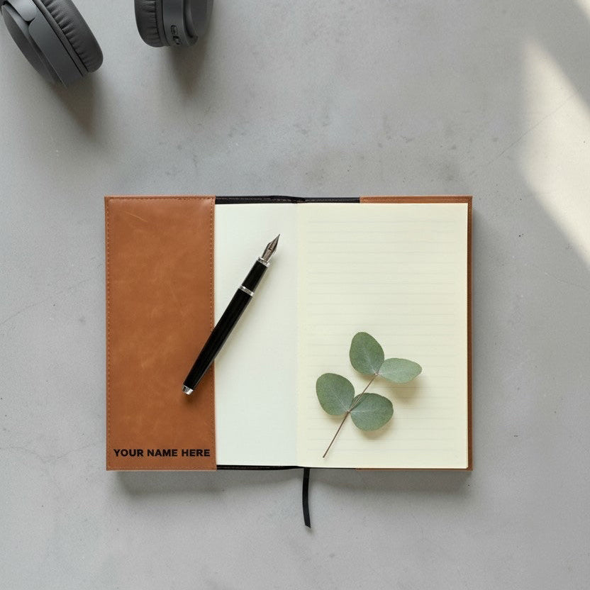 Open tan leatherette Oklahoma journal showing lined pages and inside cover area where a personalized name can be engraved