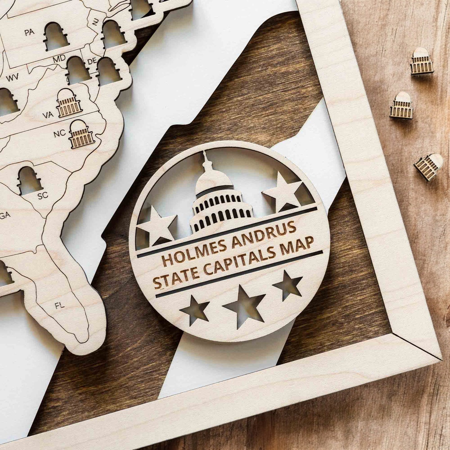Close up of personalized USA state capitals map badge with engraved Capitol icon and stars