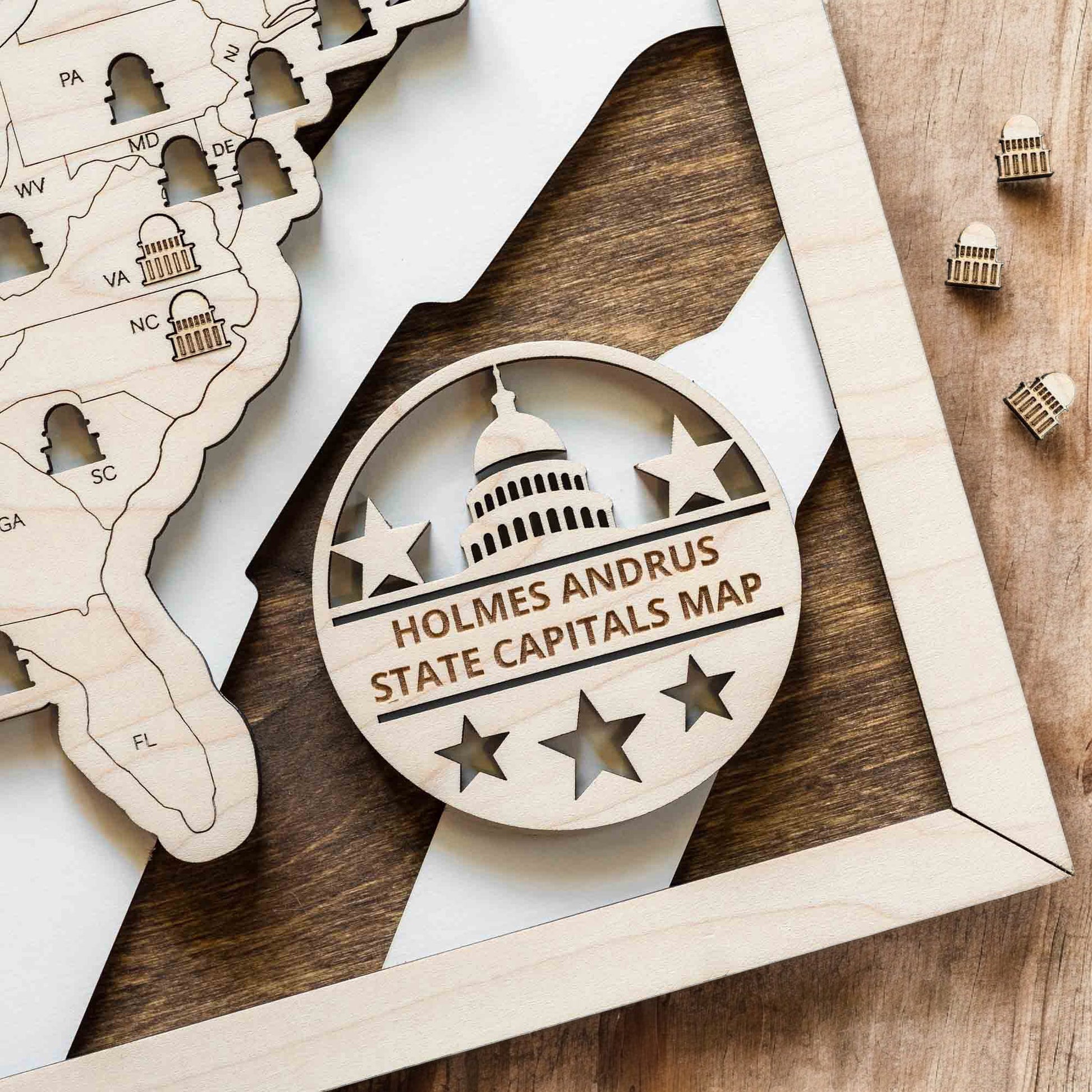 Close up of personalized USA state capitals map badge with engraved Capitol icon and stars