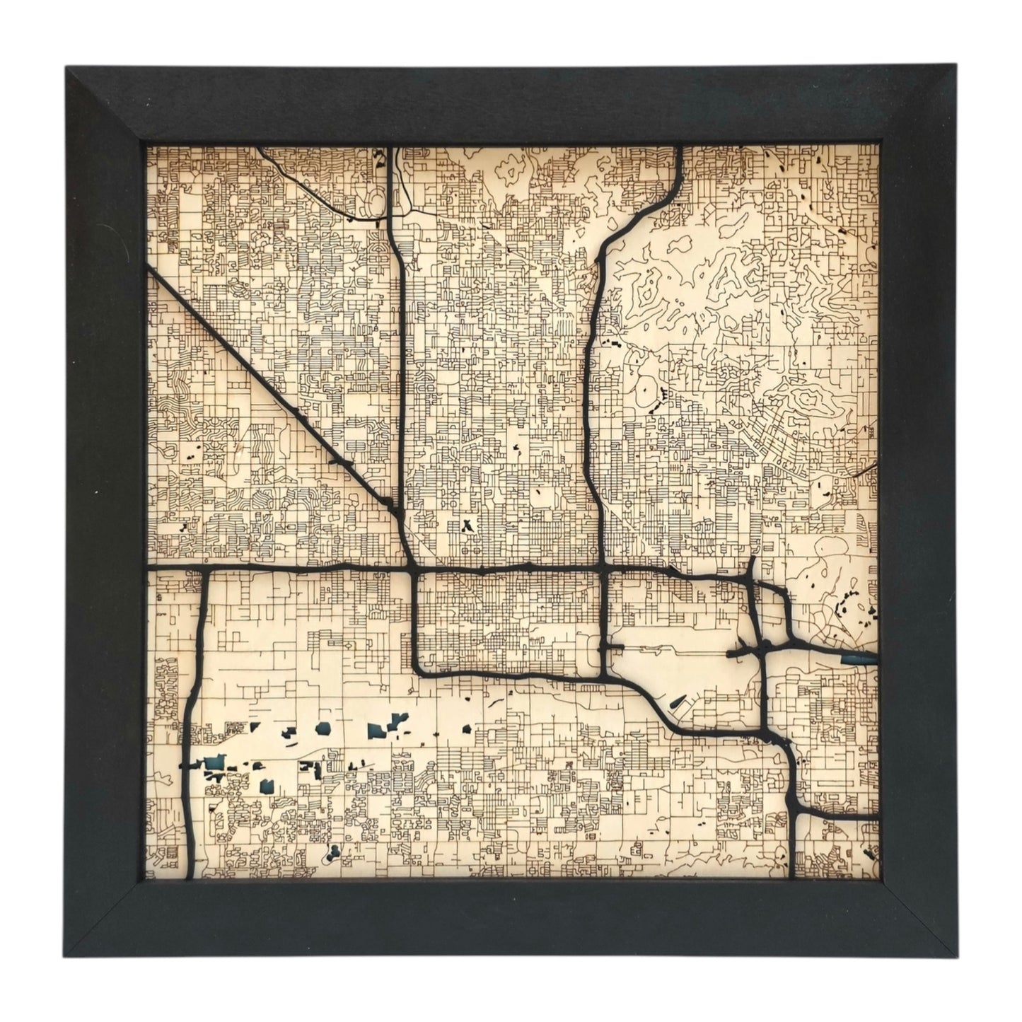 full view of Phoenix Arizona wood map wall art with engraved street grid and raised road layers in black frame city decor