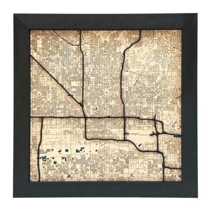 full view of Phoenix Arizona wood map wall art with engraved street grid and raised road layers in black frame city decor