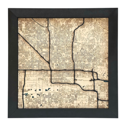 full view of Phoenix Arizona wood map wall art with engraved street grid and raised road layers in black frame city decor