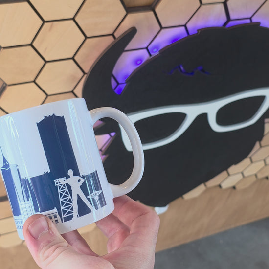 Tulsa skyline coffee mug with navy design and bold “TULSA” text